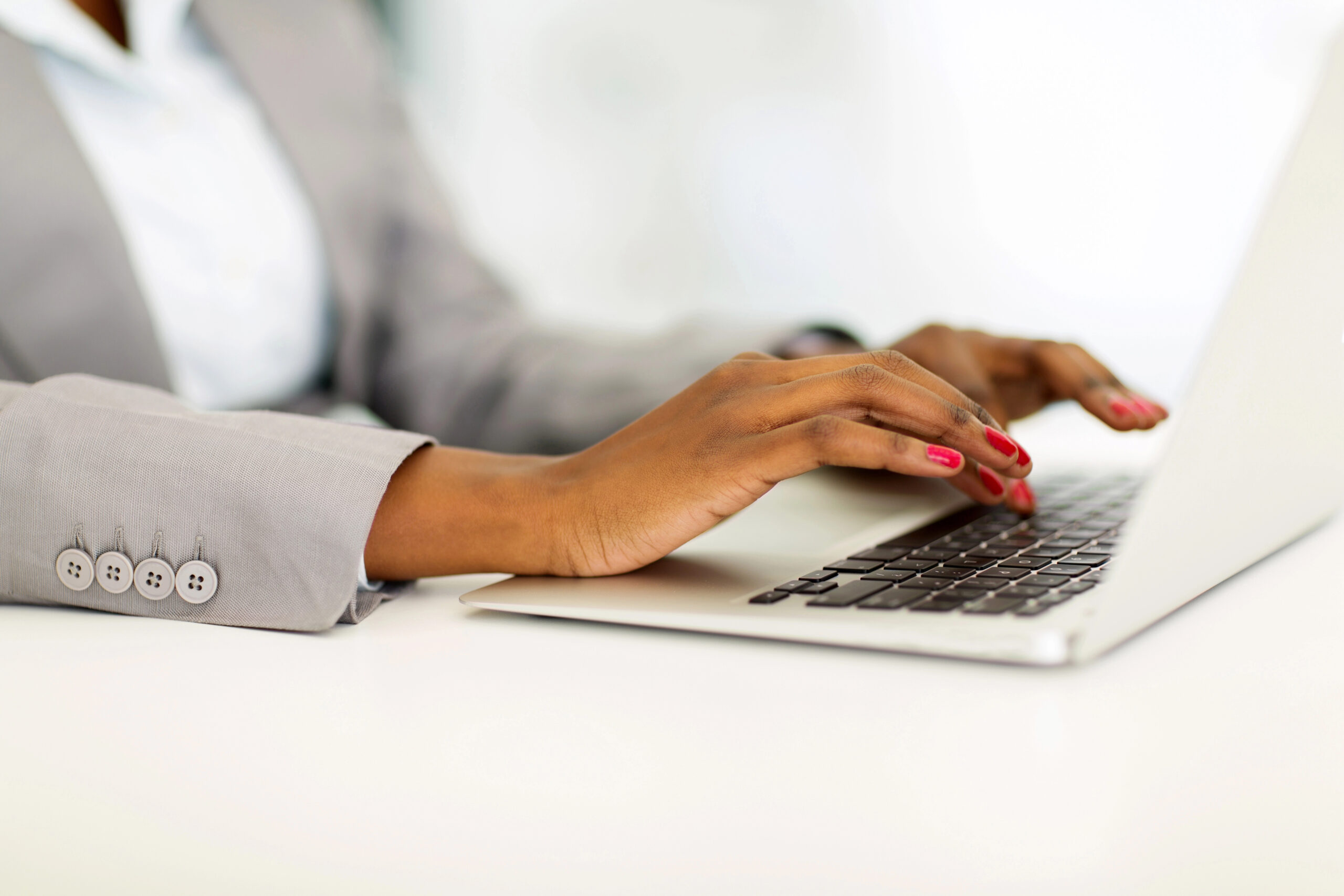 A lady is working on laptop